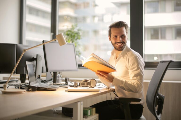Guy on Desk Smiling